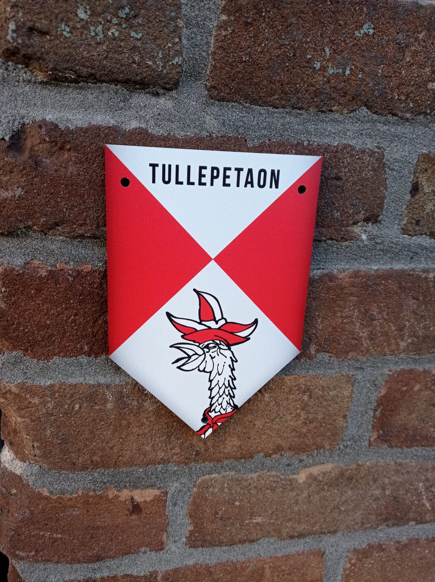 Tullepetaonestad muurschildje